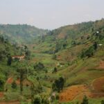 Gatare washing station mountain view with red earth in Rwanda coffee growing region