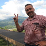 Coffee producer Cristian Rodriguez at his drying beds at Tio Juan
