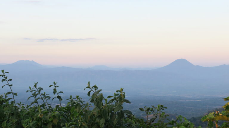 Beautiful sunset view of distant mountains from coffee farm Finca Villa Galicia in El Salvador