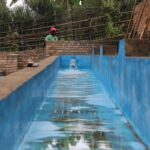 Washing channels to wash mucilage off green coffee beans to create washed process cup profiles in Tumba washing station Rwanda