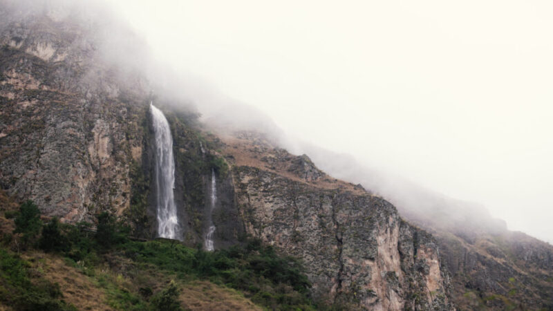 Misty mountains with waterfall view from coffee farm La Papaya in Ecuador