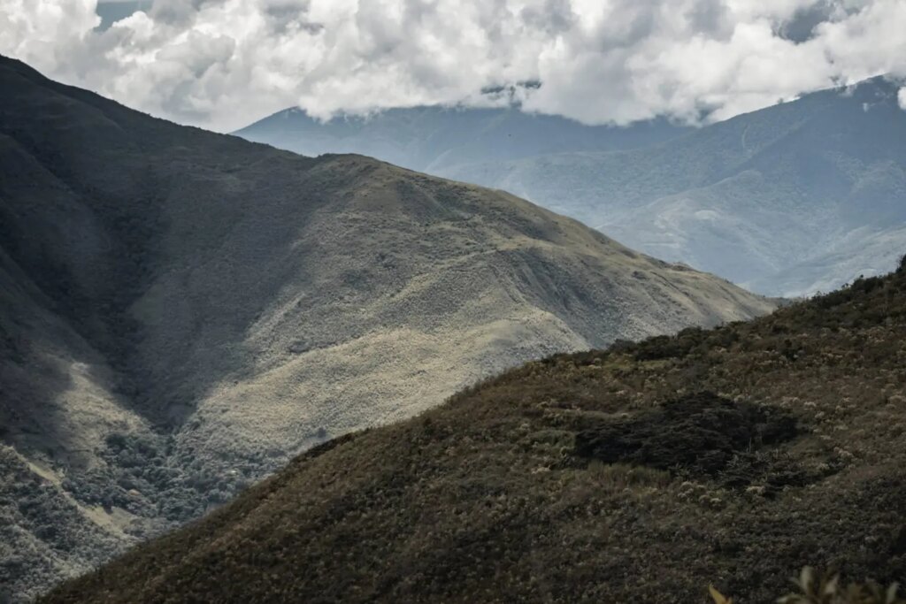 Mountain landscape in Peru with clouds and sun