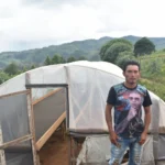 Producer Walter Samuel Ramirez outside his coffee drying tent at Finca el Pino Honduras